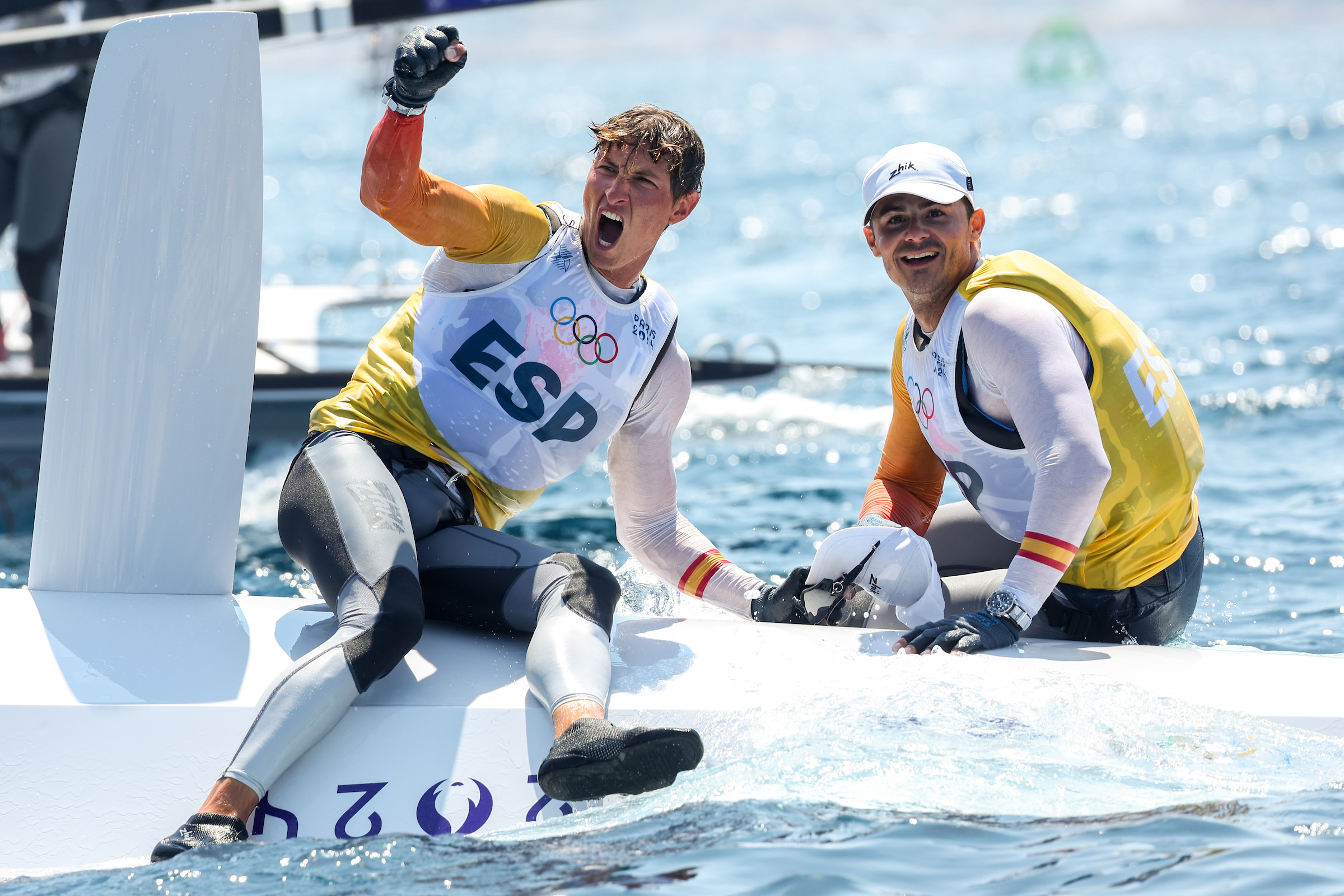 Diego Botin and Florian Trittel celebrate winning gold in the Men's Skiff